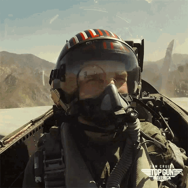 Pilot giving thumbs up signal from cockpit